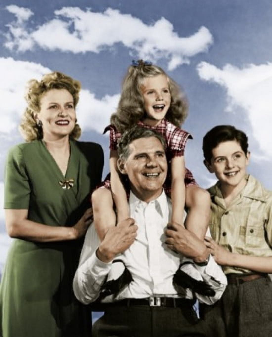 Portrait of happy family with two children against sky Canvas Art - (24 x 36)
