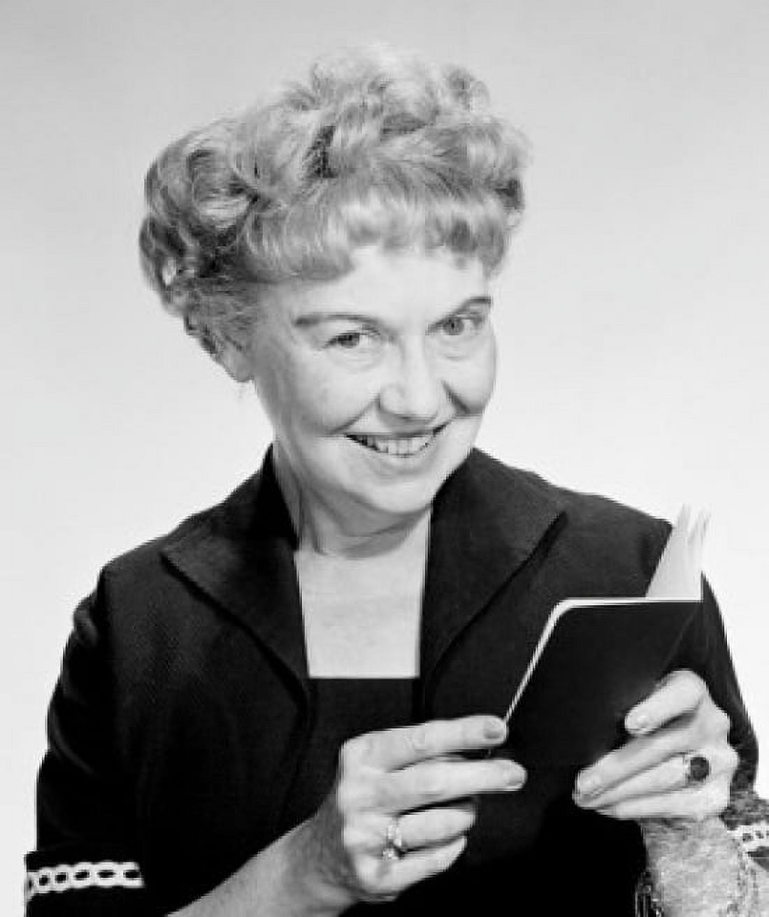 Portrait of happy mature woman holding passport studio shot Canvas Art - (24 x 36)