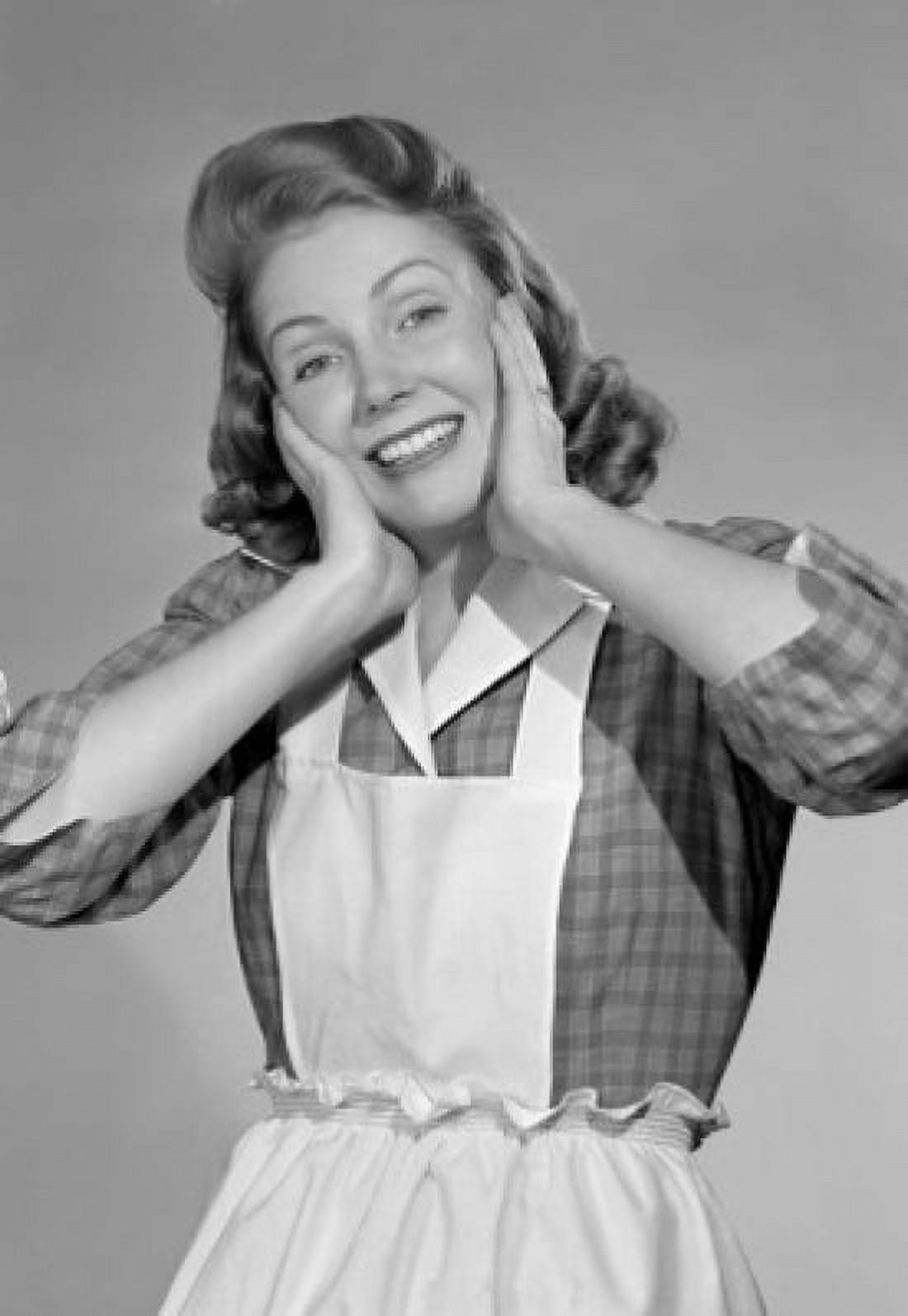 Portrait of housewife holding head in hands and smiling Canvas Art - (18 x 24)