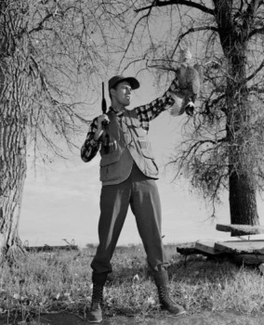 Portrait of hunter holding dead Wood Grouse Canvas Art - (18 x 24)