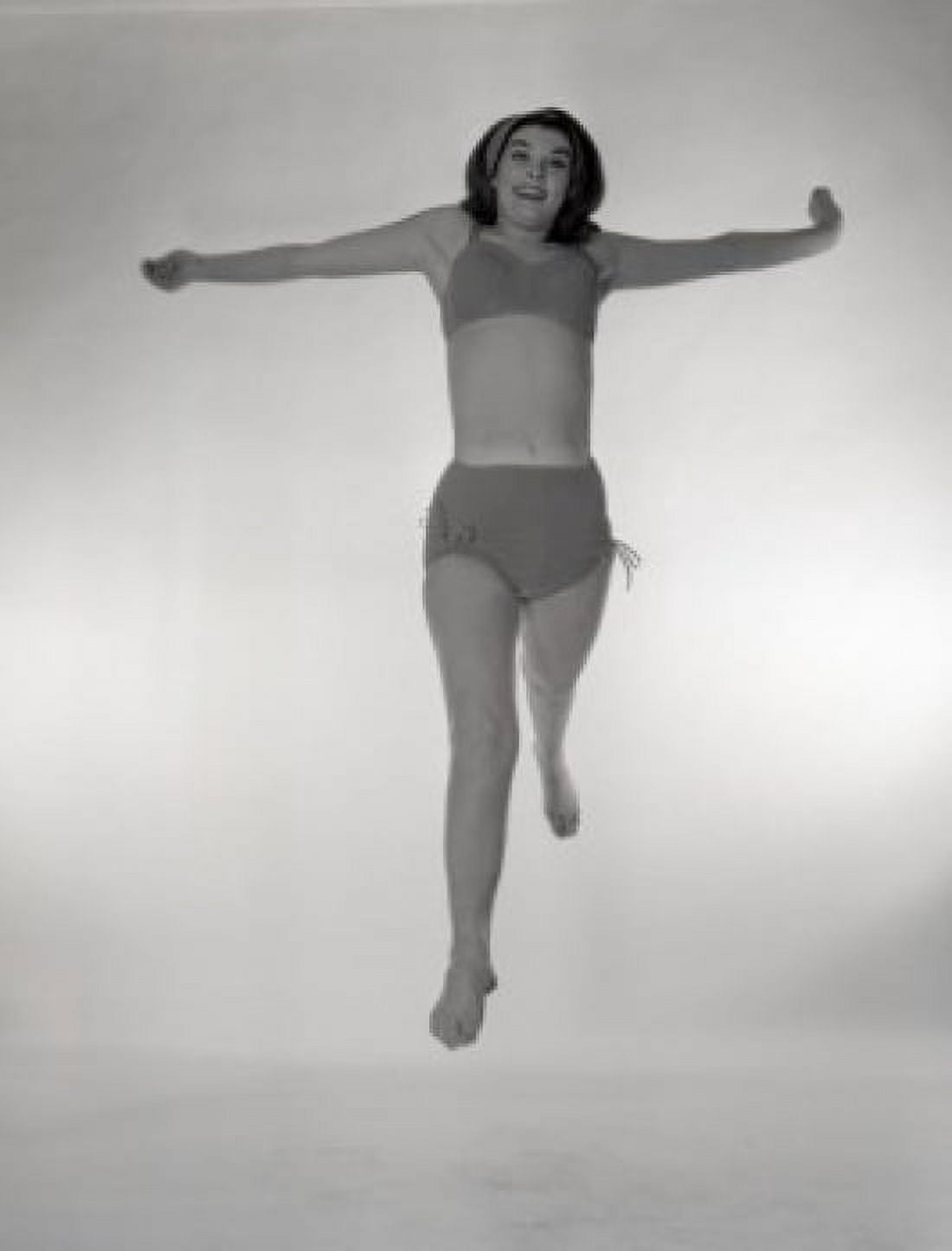 Portrait of jumping woman in bikini Canvas Art - (18 x 24)