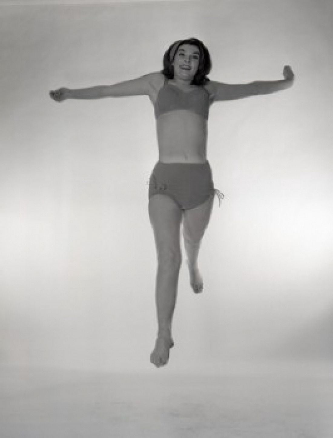 Portrait of jumping woman in bikini Canvas Art - (24 x 36)