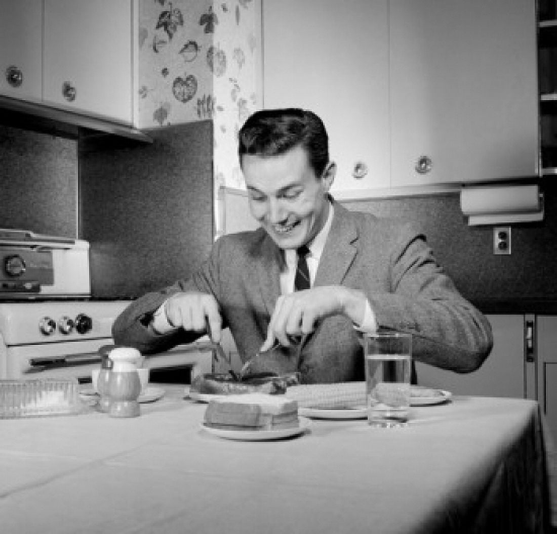 Portrait of man dining in kitchen Canvas Art - (24 x 36)