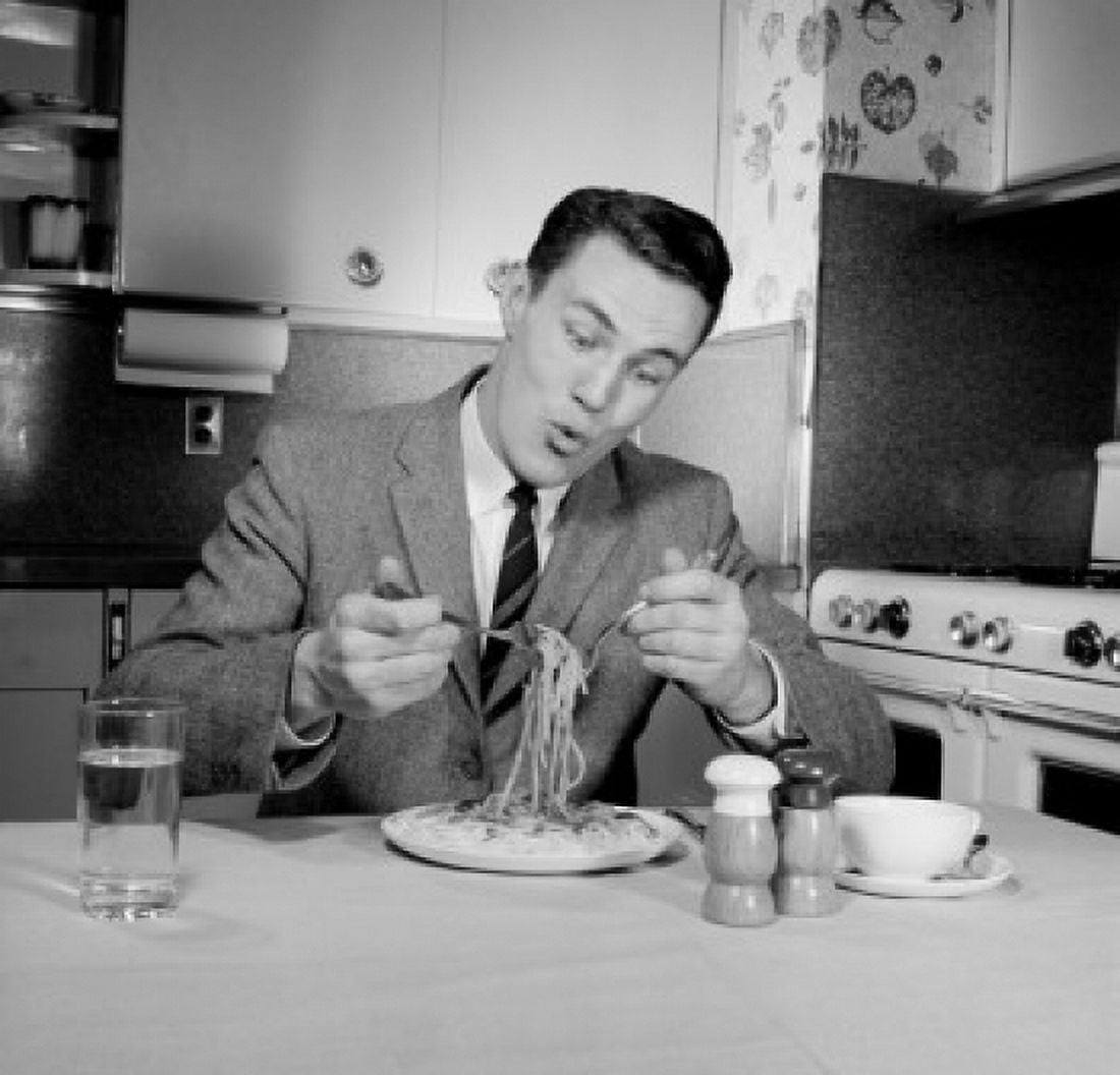 Portrait of man dining in kitchen Canvas Art -  (24 x 36)