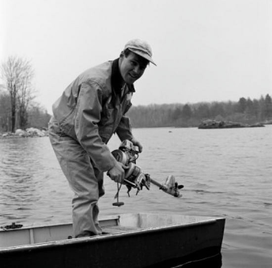 Portrait of man in boat holding engine Canvas Art - (18 x 24)