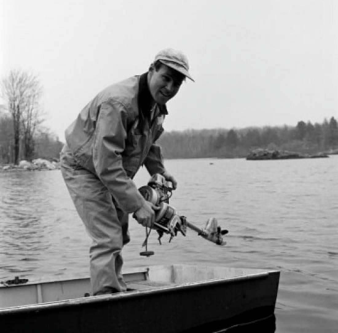 Portrait of man in boat holding engine Canvas Art - (24 x 36)