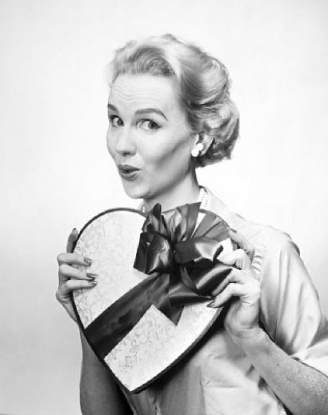 Portrait of mid adult woman holding Valentine gift Canvas Art - (18 x 24)