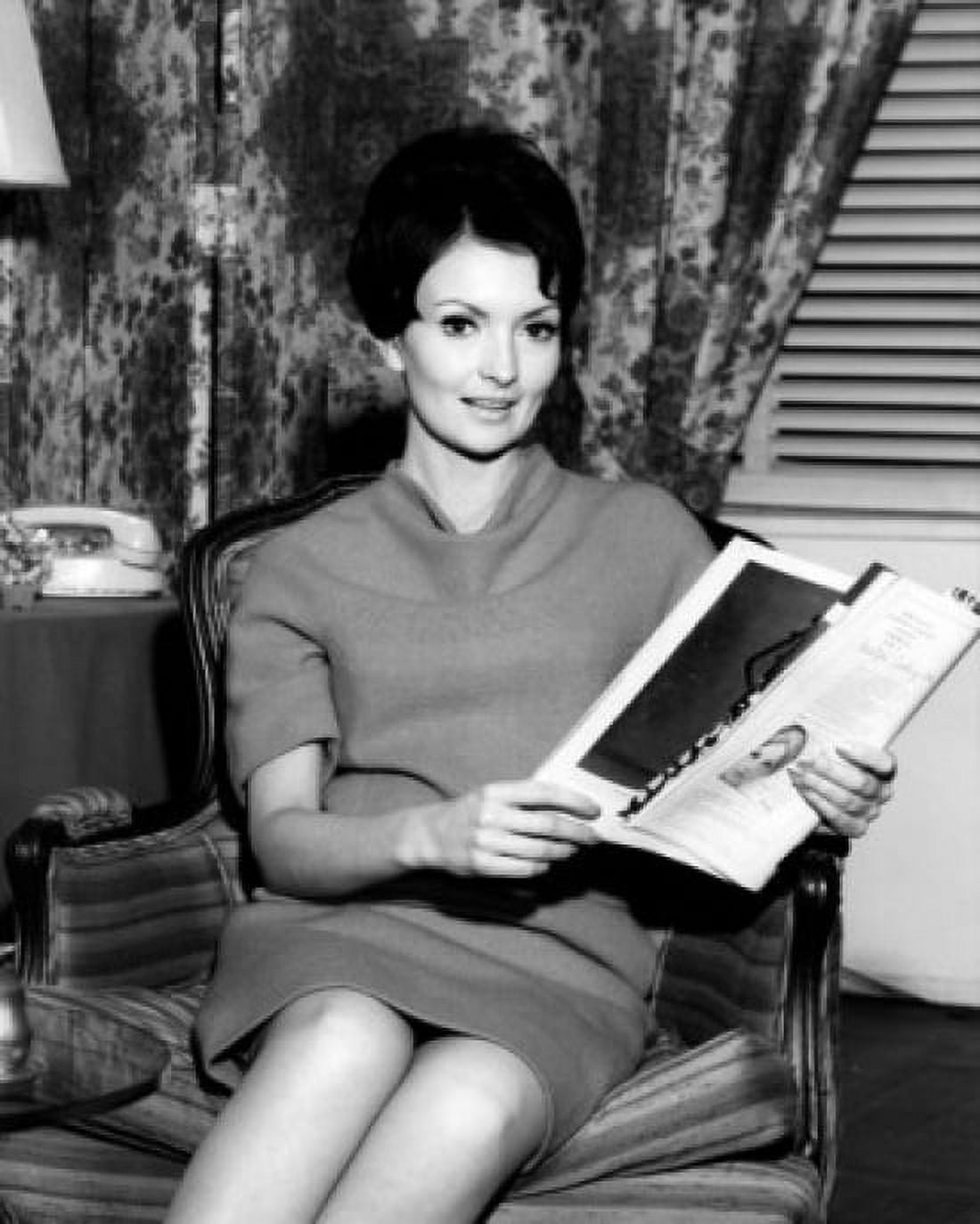 Portrait of mid adult woman in armchair reading magazine Canvas Art - (18 x 24)