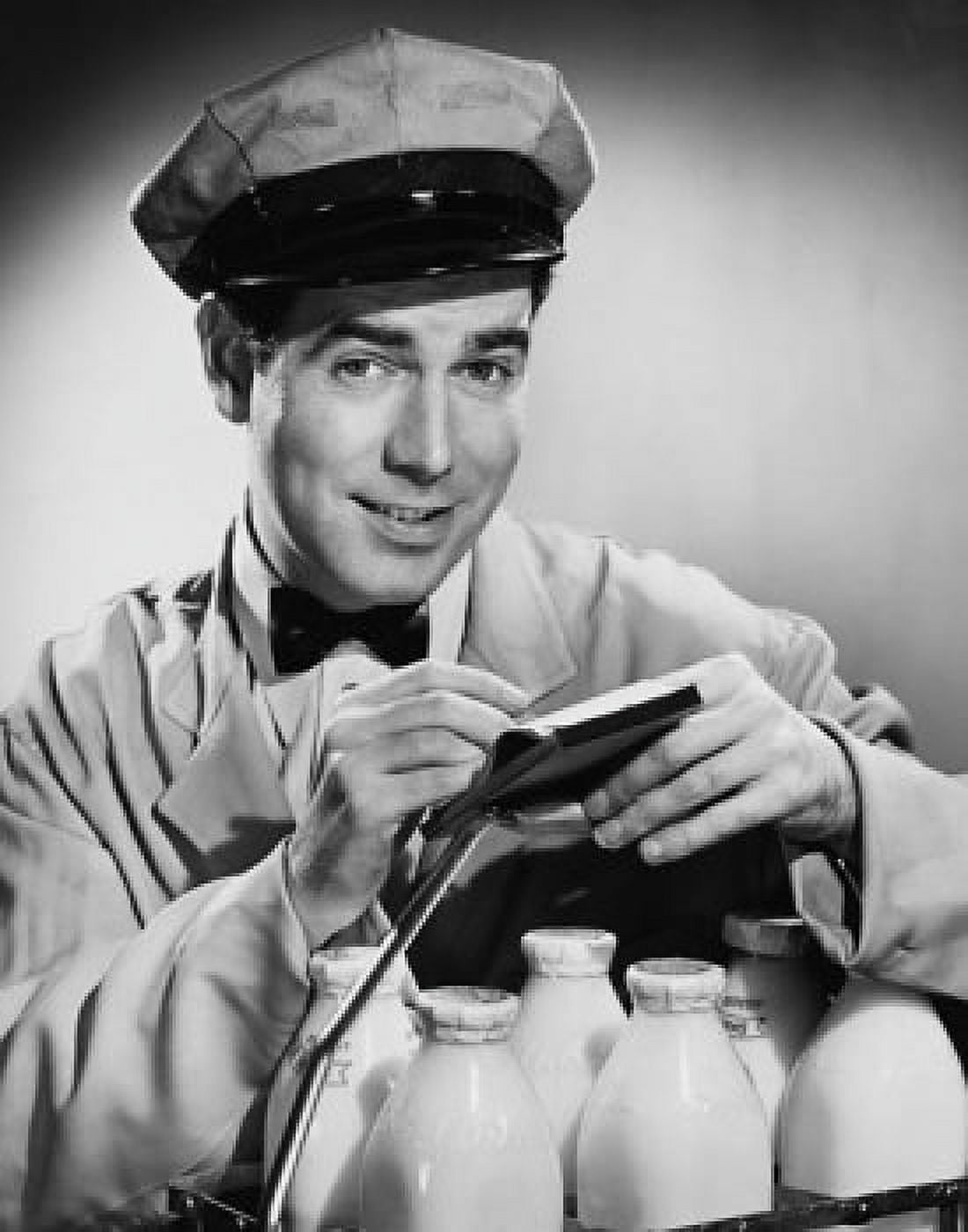 Portrait of milkman writing on note pad Canvas Art - (18 x 24)