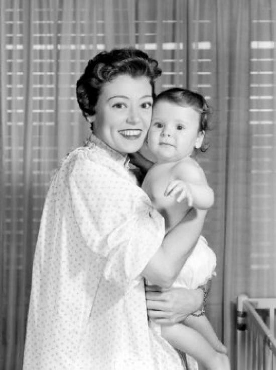 Portrait of mother embracing baby in bedroom Canvas Art - (24 x 36)