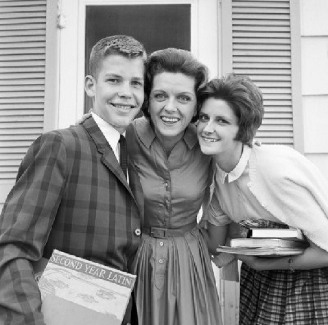 Portrait of mother with teenage son and teenage daughter standing outside house Canvas Art - (18 x 24)