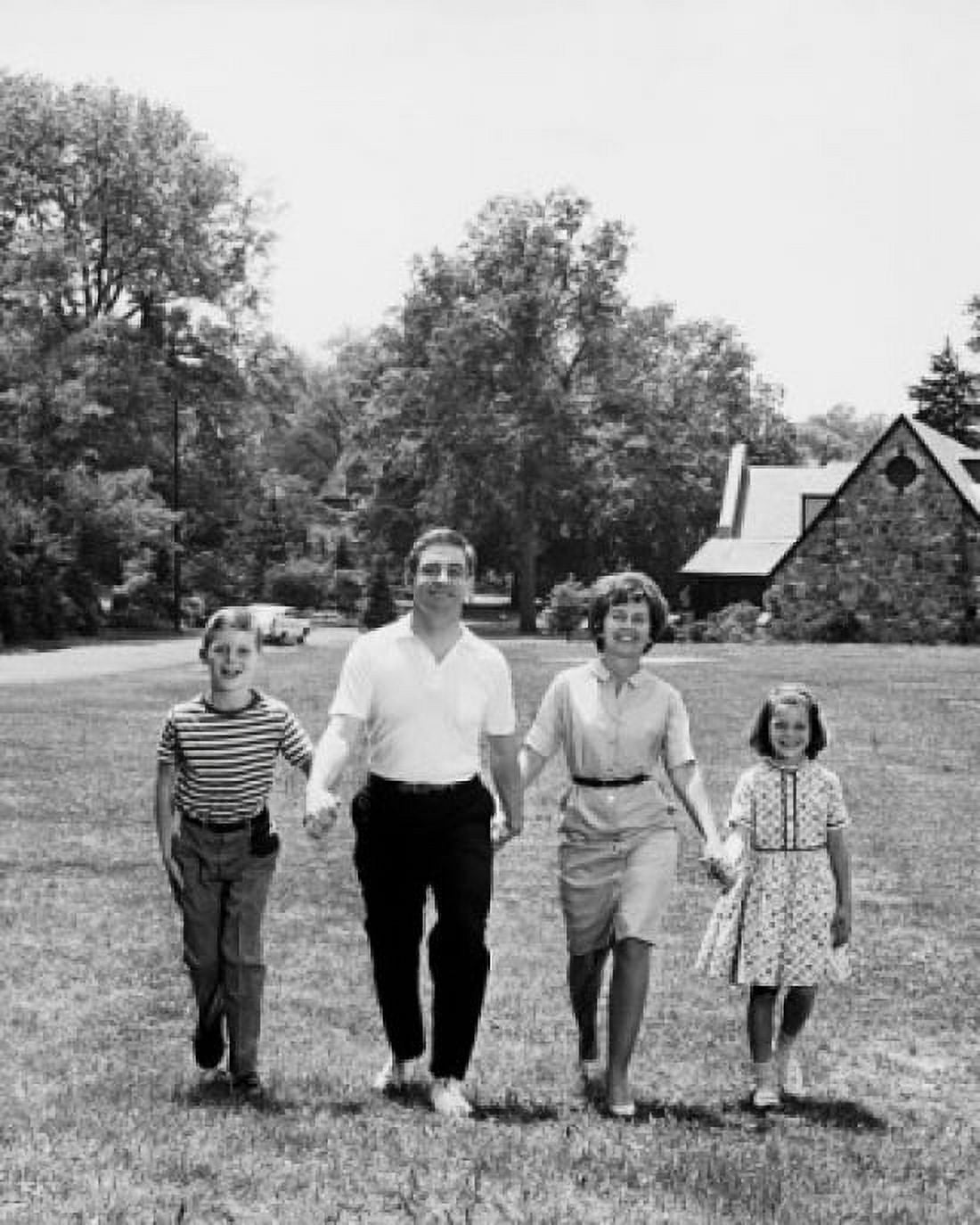 Portrait of parents and their children walking on a lawn Canvas Art - (18 x 24)