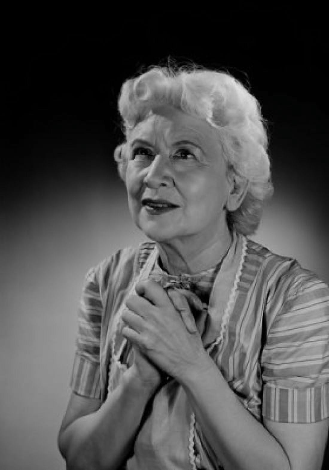 Portrait of praying senior woman studio shot Canvas Art - (18 x 24)