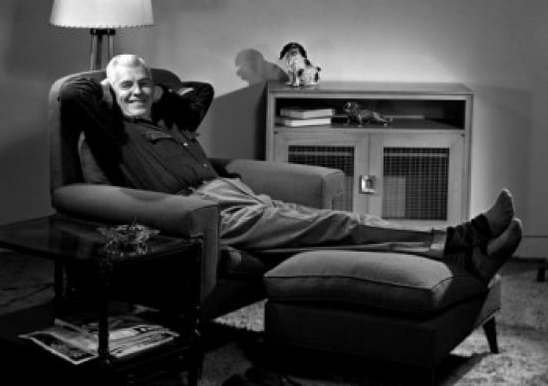 Portrait of senior man sitting in armchair Canvas Art - (24 x 36)