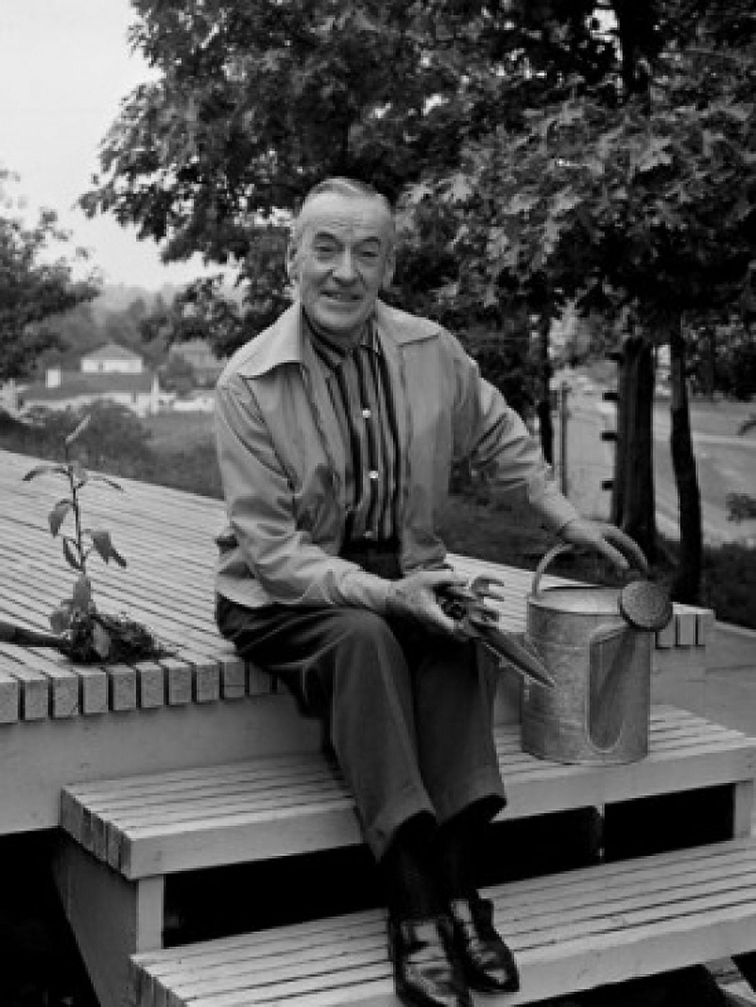 Portrait of senior man with gardening equipment on steps Canvas Art - (18 x 24)