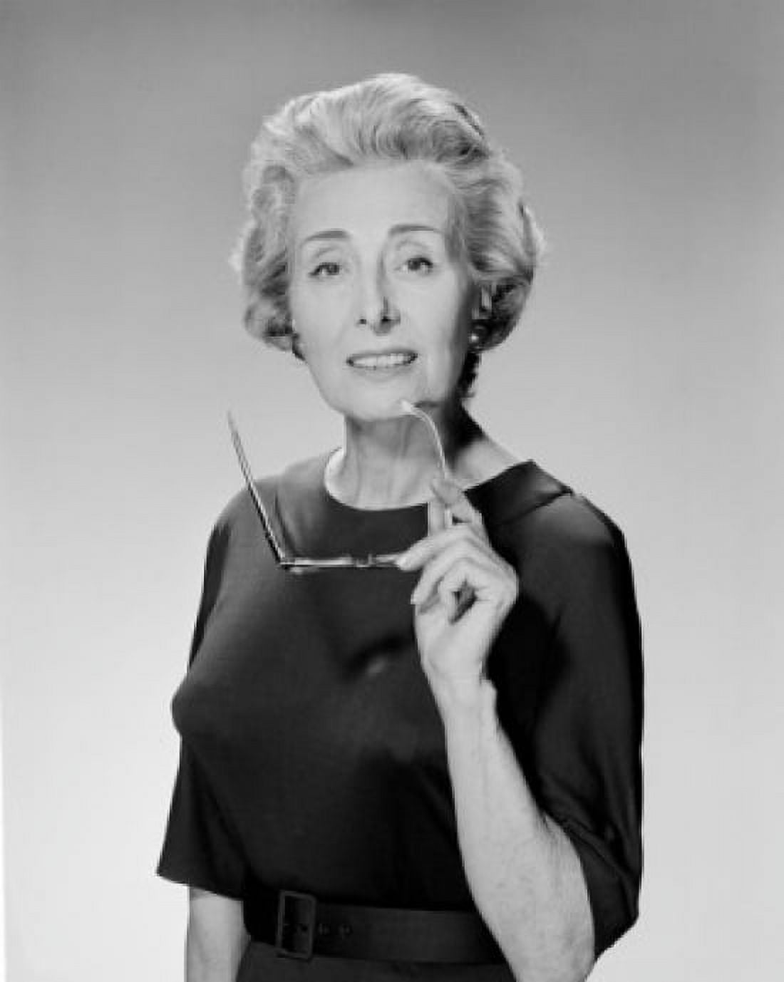 Portrait of senior woman holding glasses Canvas Art - (24 x 36)