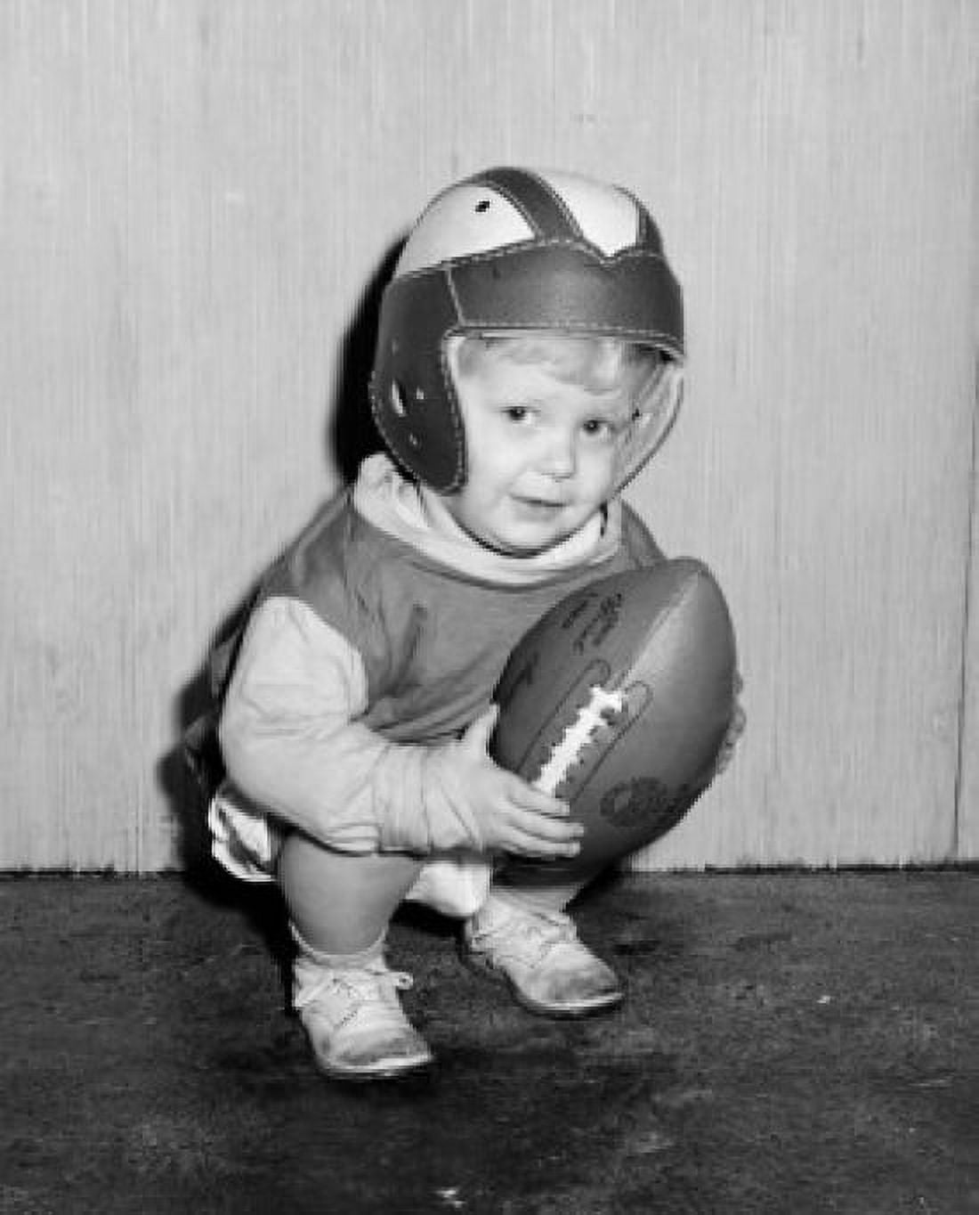 Portrait of small boy wearing baseball helmet and holding baseball ball Canvas Art - (18 x 24)