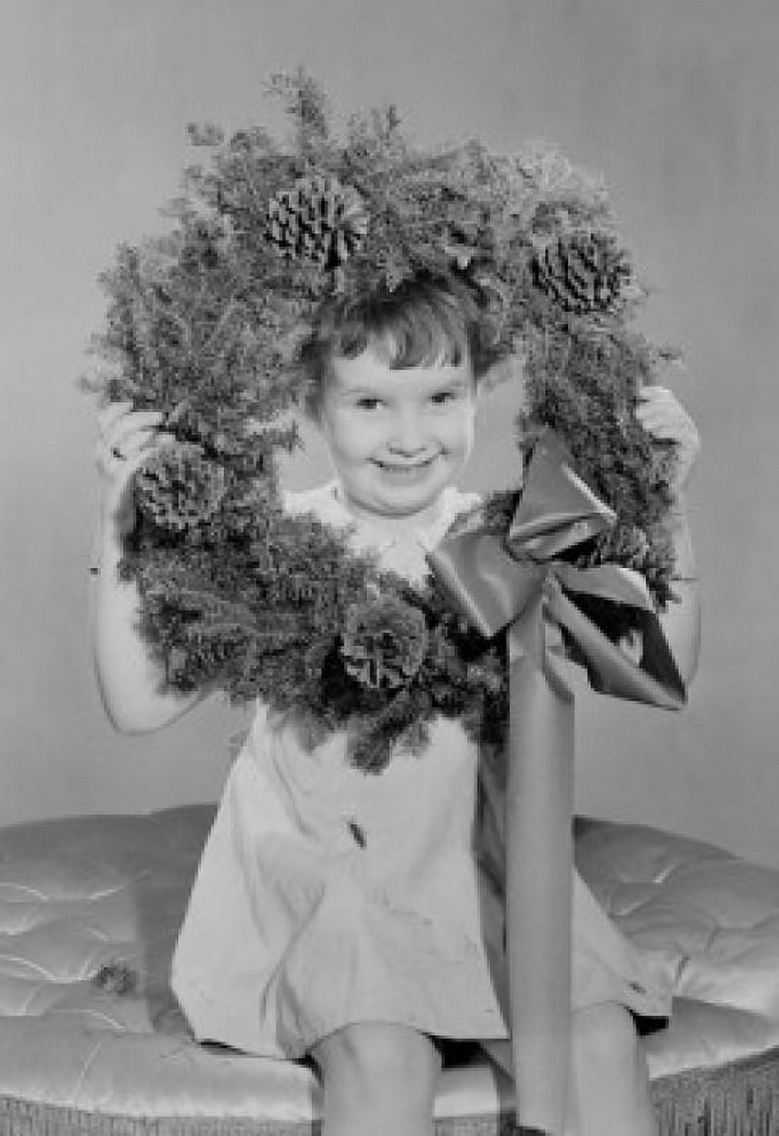 Portrait of small girl holding Christmas wreath Canvas Art - (24 x 36)