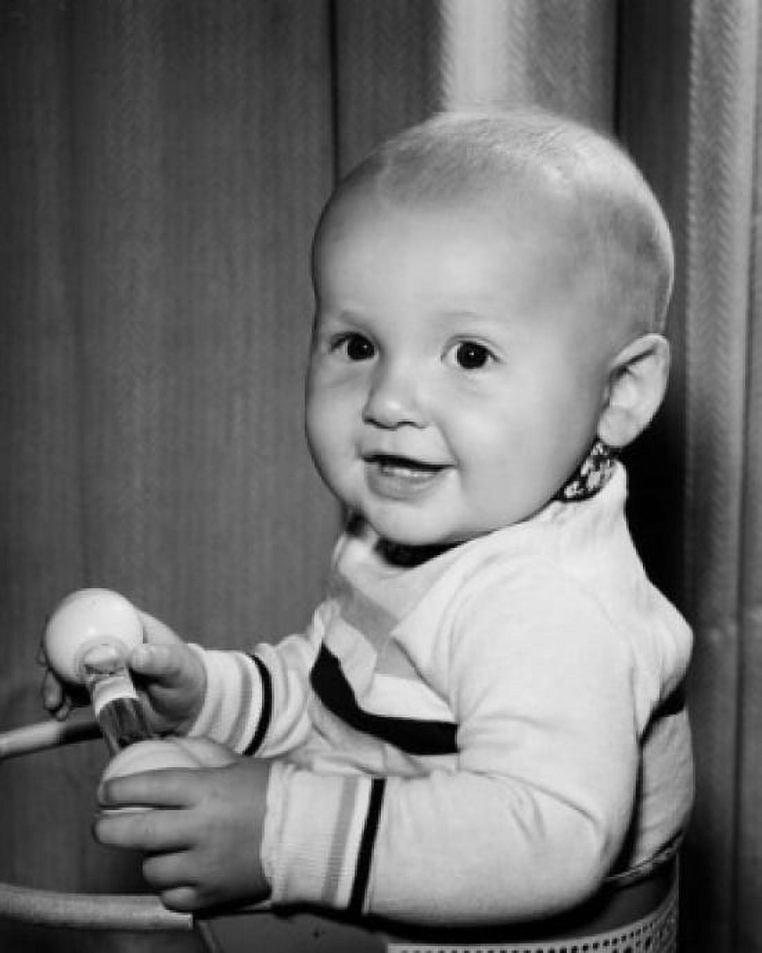 Portrait of smiling baby holding toy Canvas Art - (18 x 24)