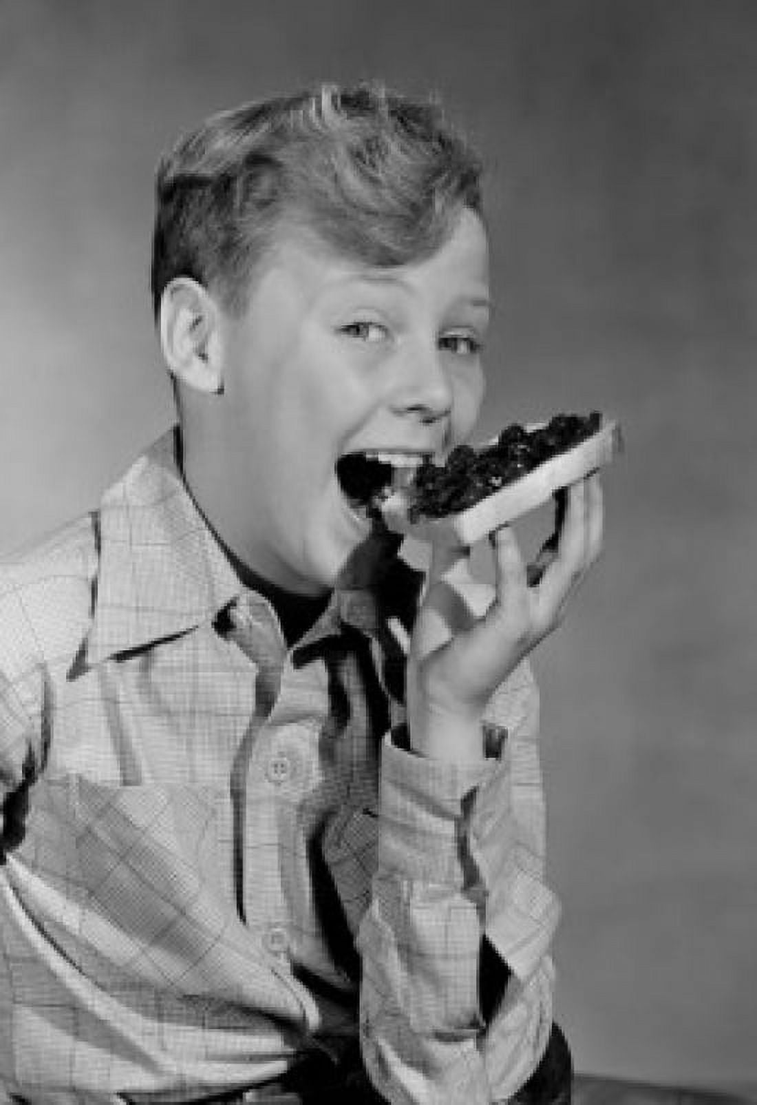 Portrait of smiling boy biting toast with jam Canvas Art - (24 x 36)