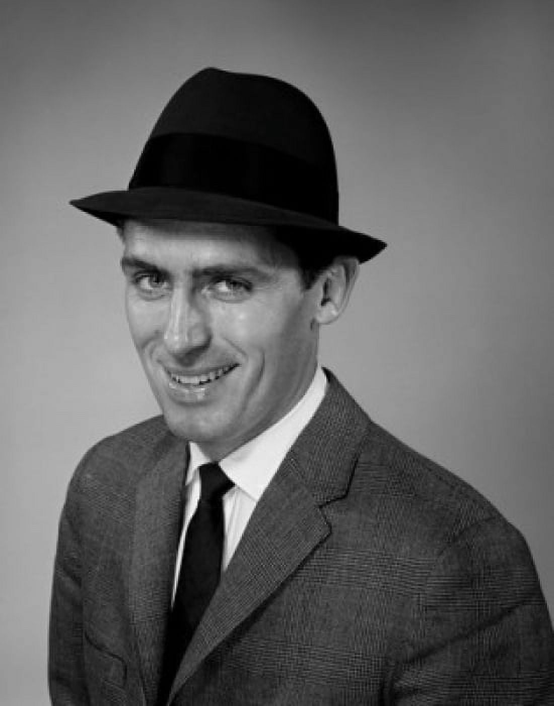 Portrait of smiling businessman wearing hat studio shot Canvas Art - (24 x 36)