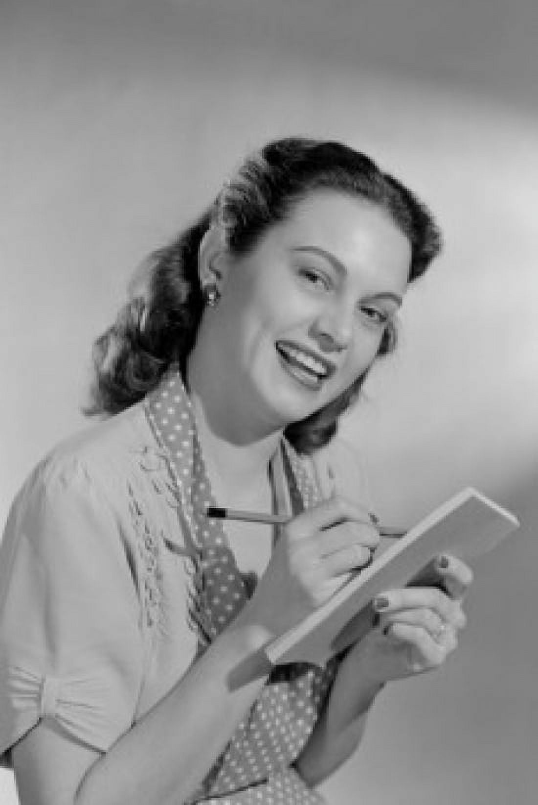 Portrait of smiling housewife with shopping list Canvas Art - (24 x 36)