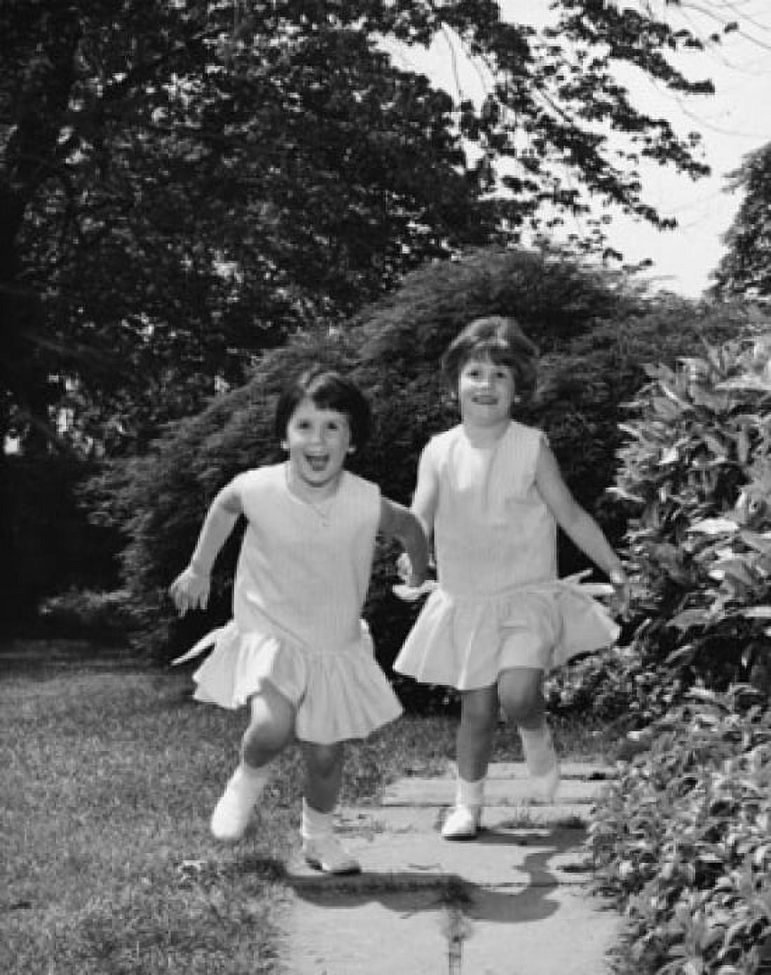 Portrait of two girls holding hands and running Canvas Art - (18 x 24)