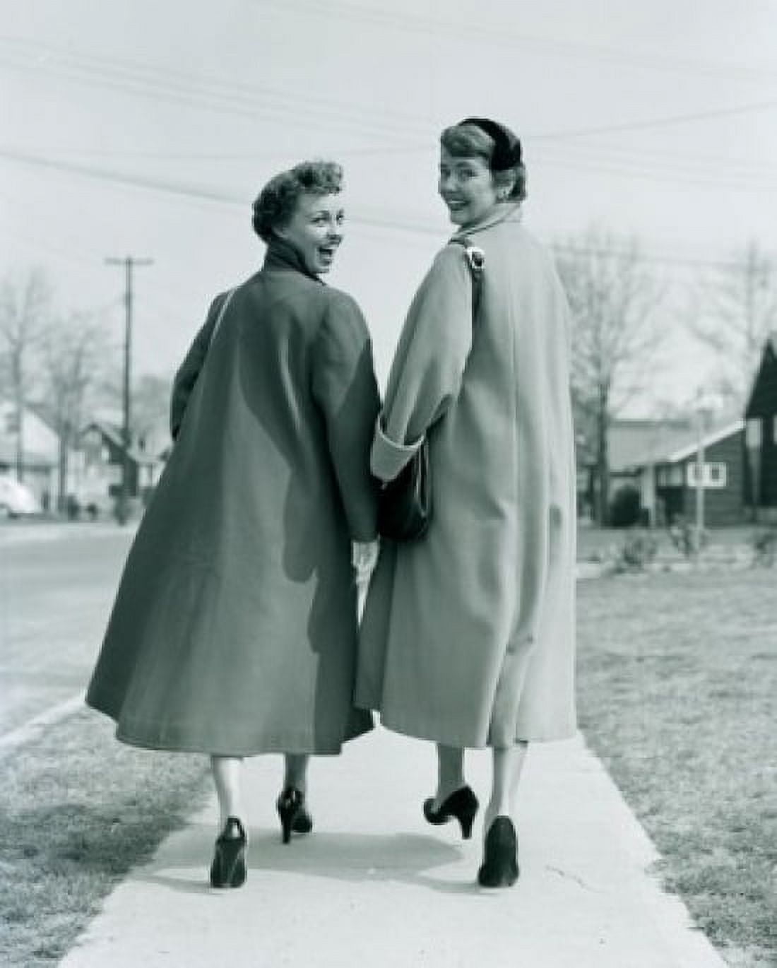 Portrait of two young women walking on pavement Canvas Art - (24 x 36)