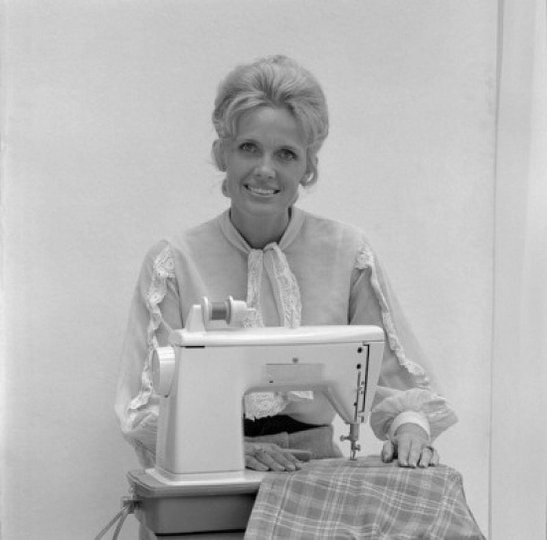 Portrait of woman at sewing machine Canvas Art - (18 x 24)
