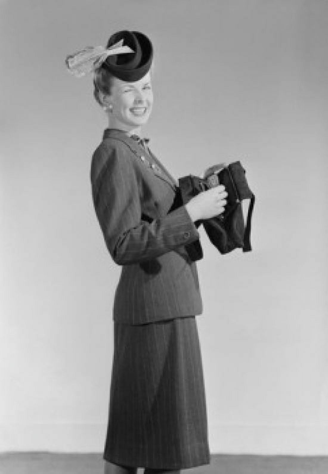 Portrait of woman in hat opening purse and winking Canvas Art - (24 x 36)