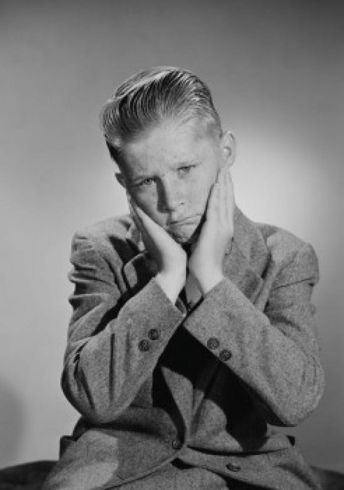 Portrait of worried teenage boy studio shot Canvas Art - (24 x 36)