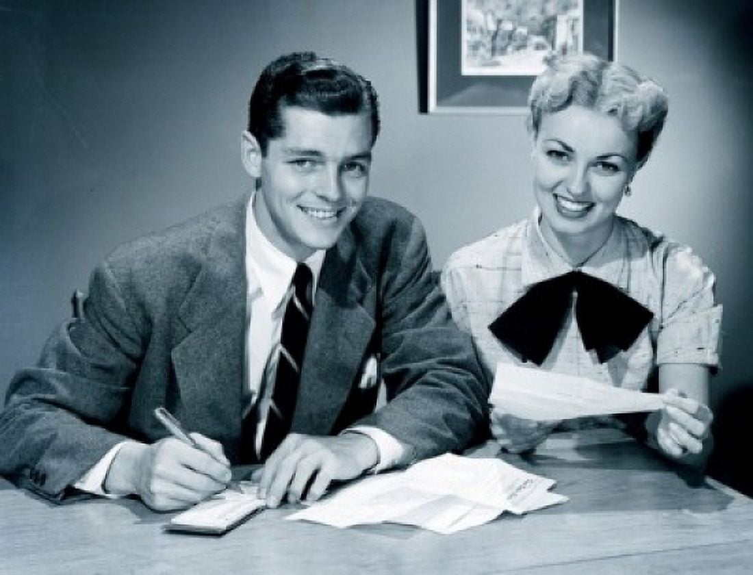 Portrait of young couple signing documents in office Canvas Art - (24 x 36)