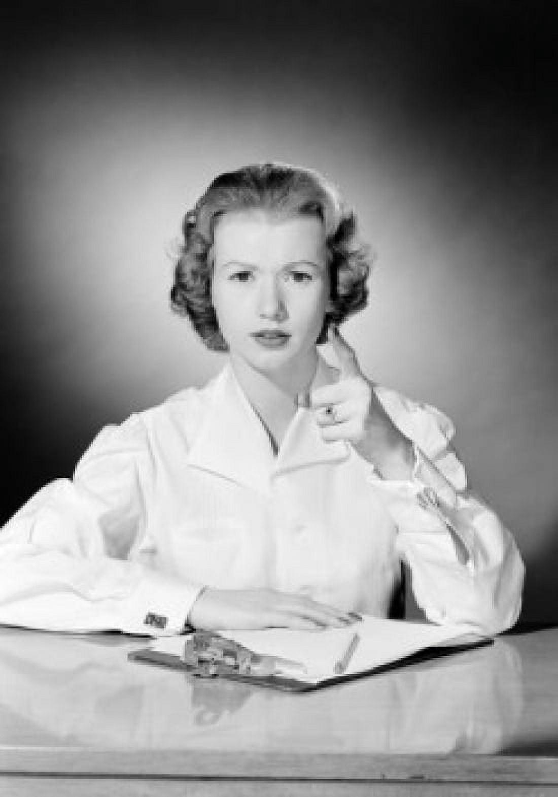 Portrait of young female office worker pointing towards camera Canvas Art - (24 x 36)