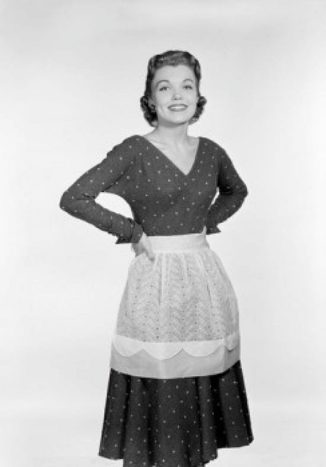 Portrait of young housewife wearing apron Canvas Art - (24 x 36)