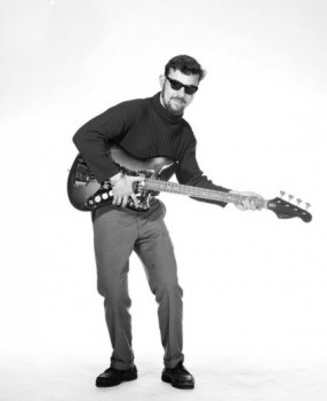 Portrait of young man playing base guitar Canvas Art - (24 x 36)