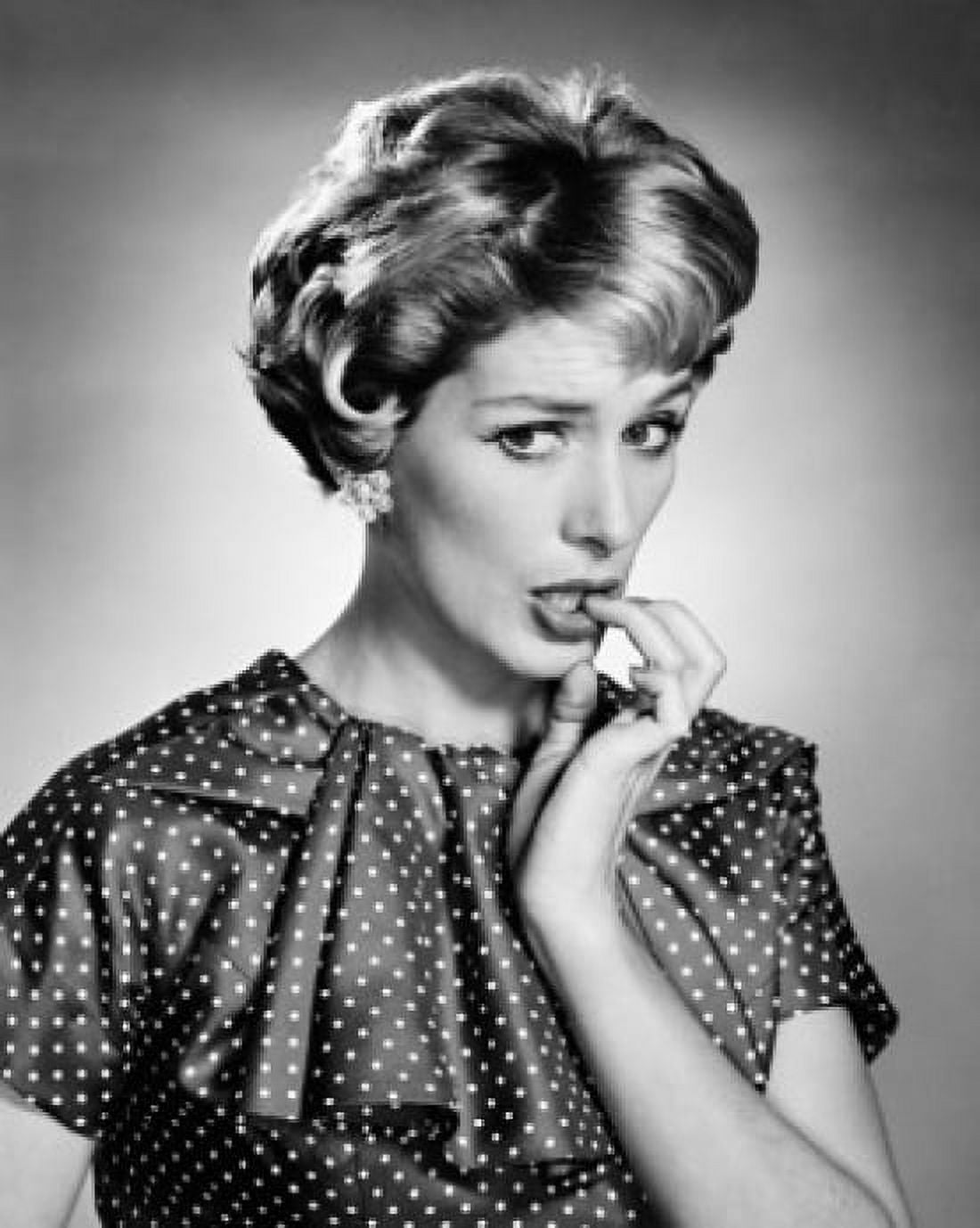 Portrait of young woman biting her nails Canvas Art - (18 x 24)