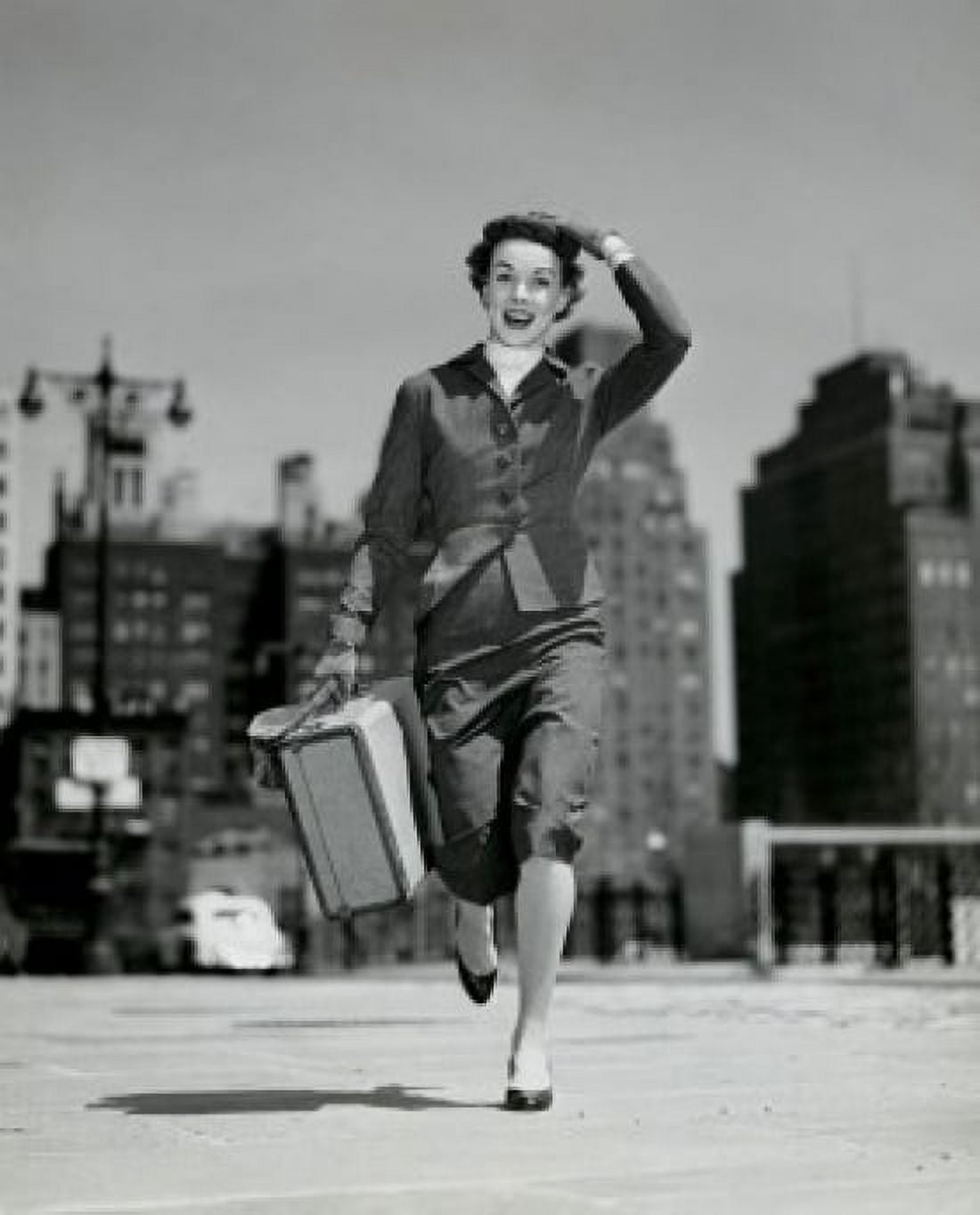 Portrait of young woman carrying suitcase Canvas Art - (18 x 24)