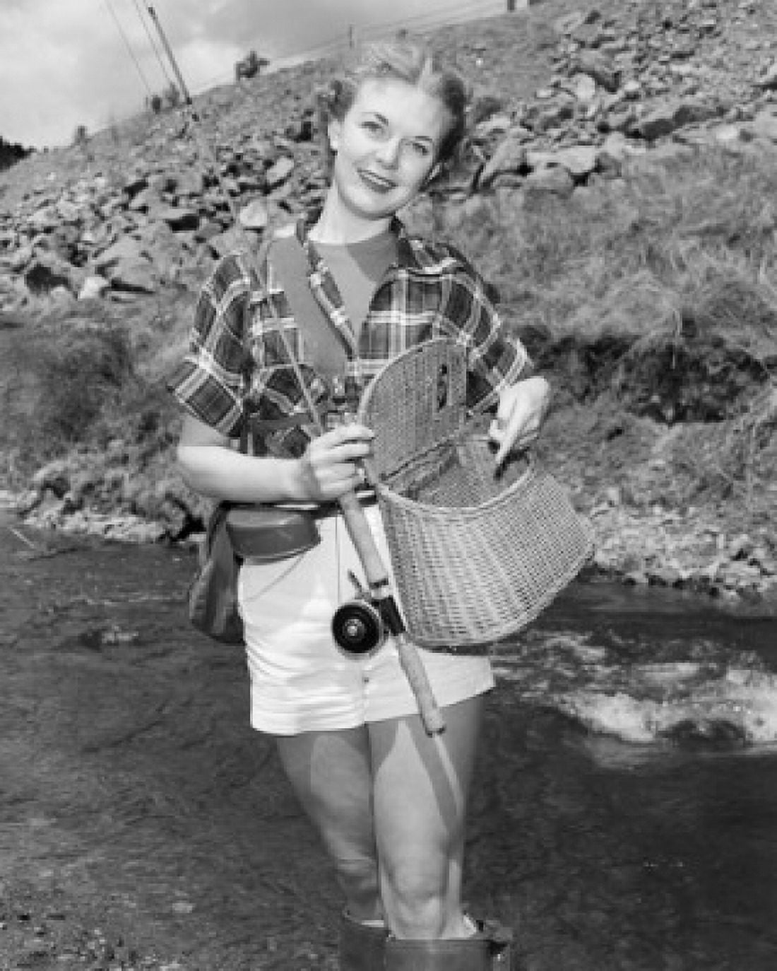 Portrait of young woman fishing Canvas Art - (18 x 24)