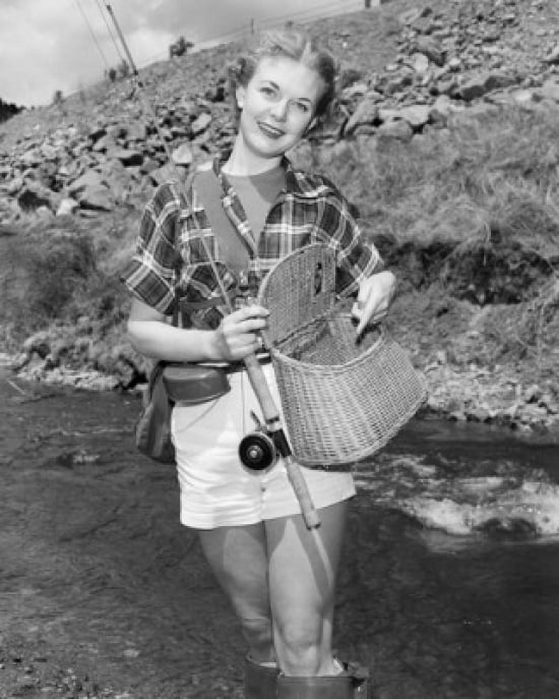 Portrait of young woman fishing Canvas Art - (24 x 36)