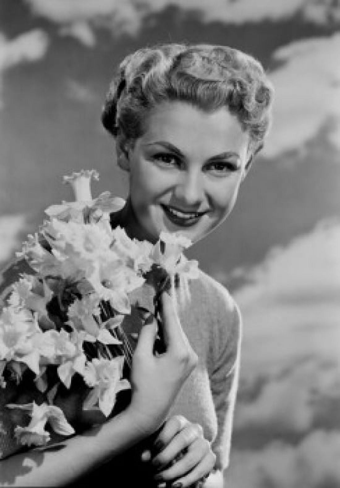 Portrait of young woman holding bunch of daffodils Canvas Art - (24 x 36)