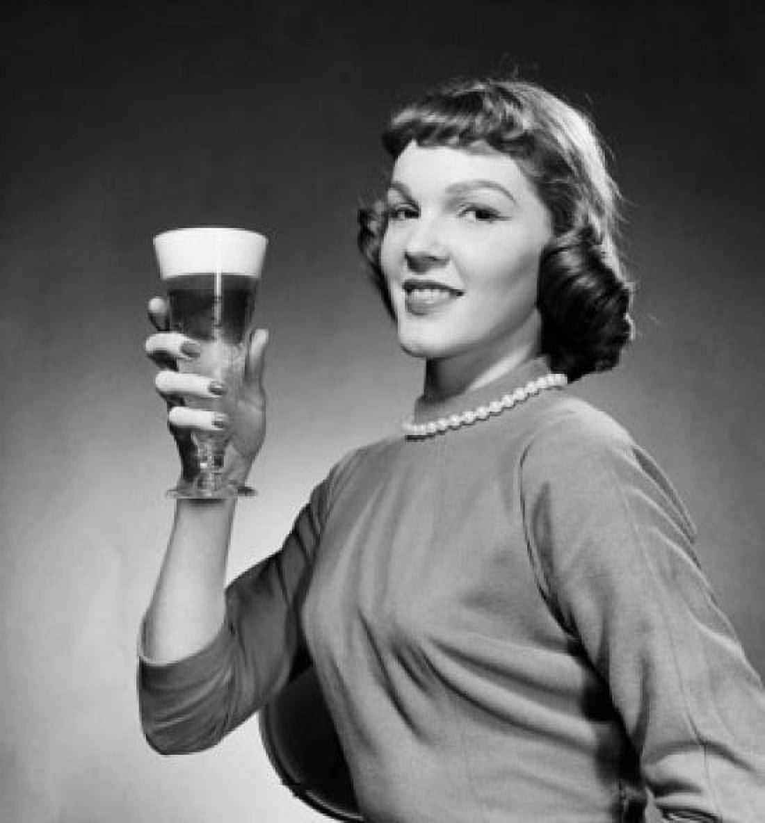 Portrait of young woman holding glass of beer Canvas Art - (24 x 36)