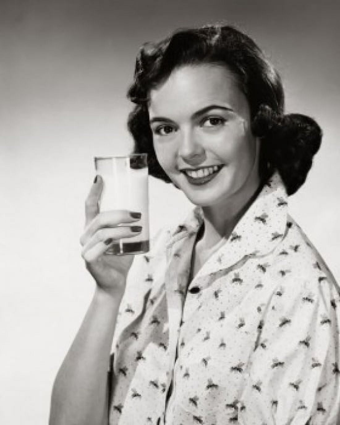 Portrait of young woman holding glass of milk Canvas Art - (18 x 24)