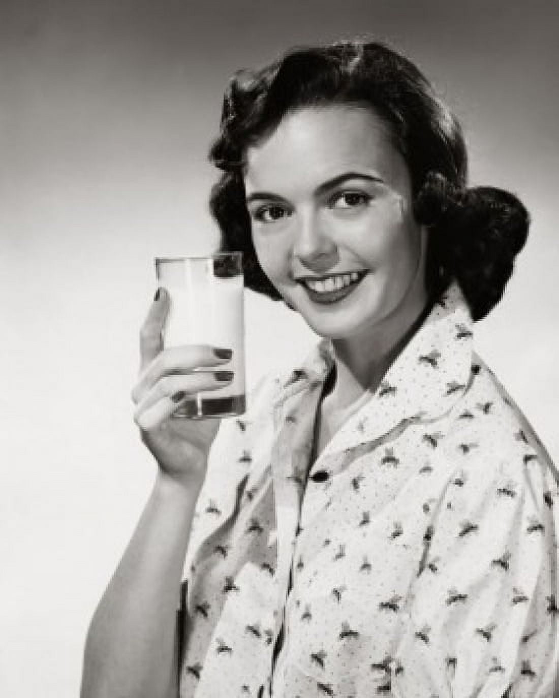 Portrait of young woman holding glass of milk Canvas Art - (24 x 36)
