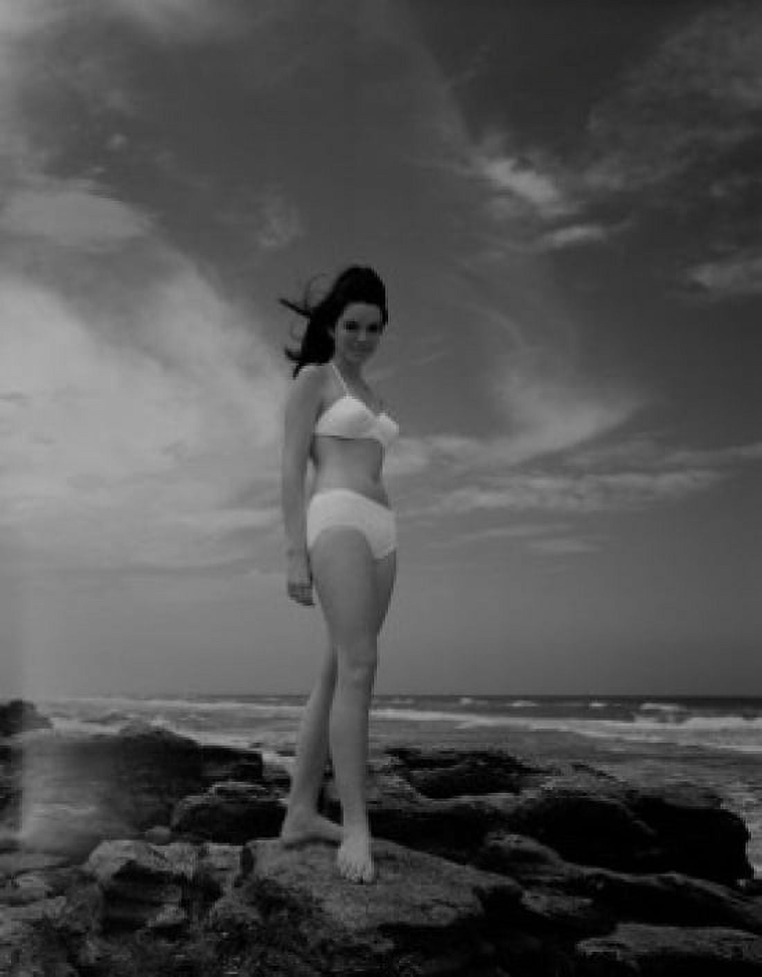 Portrait of young woman in bikini standing on rocky seashore Canvas Art - (24 x 36)
