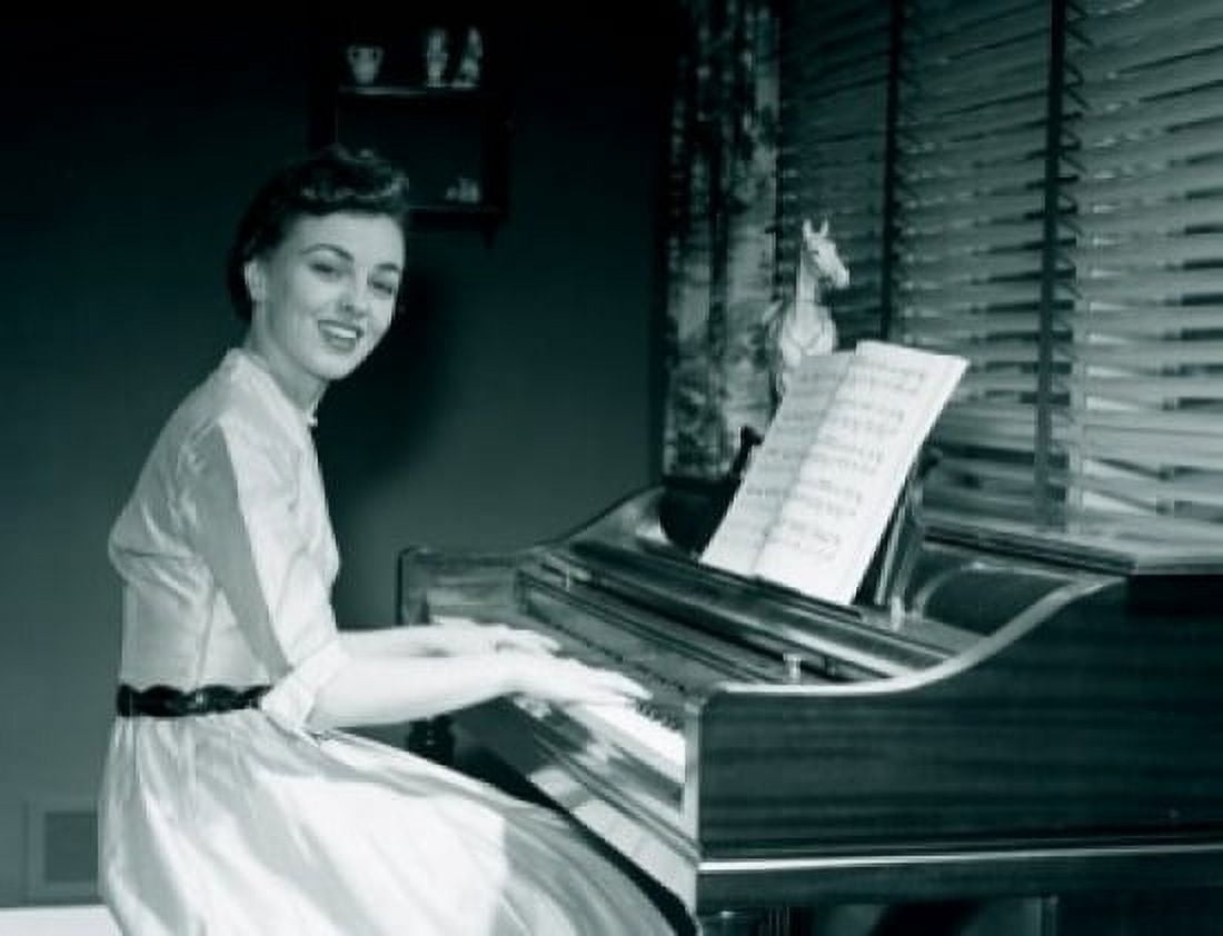 Portrait of young woman playing piano at home Canvas Art - (24 x 36)