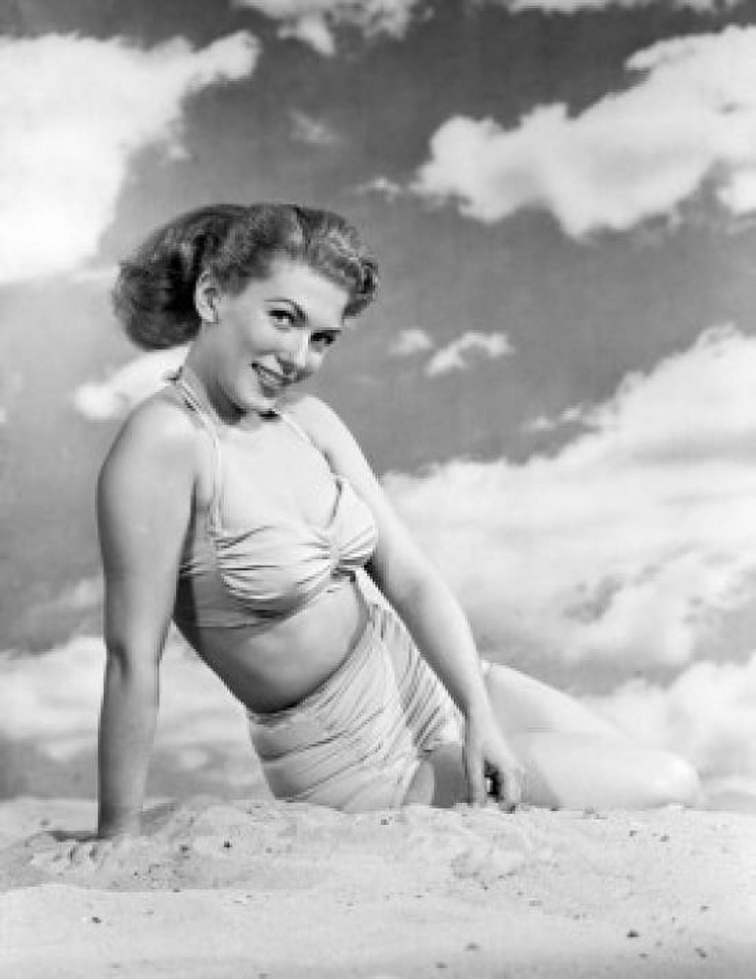 Portrait of young woman sitting on beach Canvas Art - (24 x 36)
