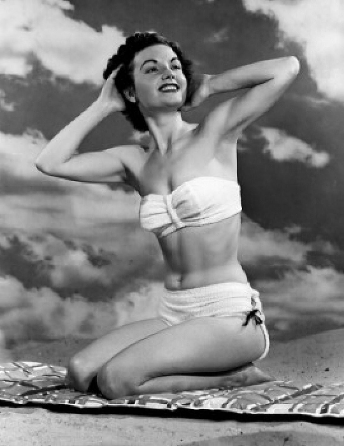 Portrait of young woman sitting on beach Canvas Art - (24 x 36)