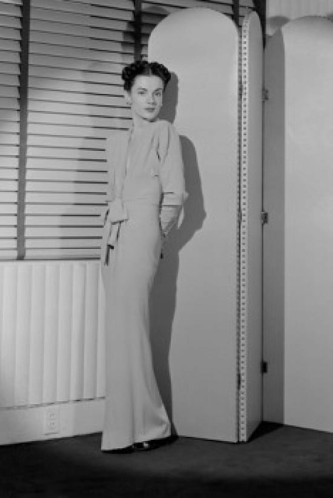 Portrait of young woman standing behind screen partition Canvas Art - (24 x 36)