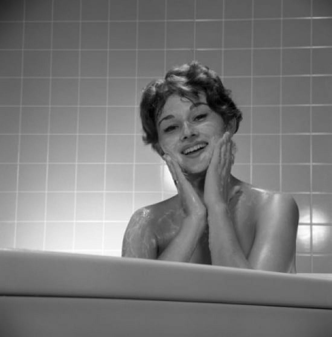 Portrait of young woman washing face in bath Canvas Art - (18 x 24)