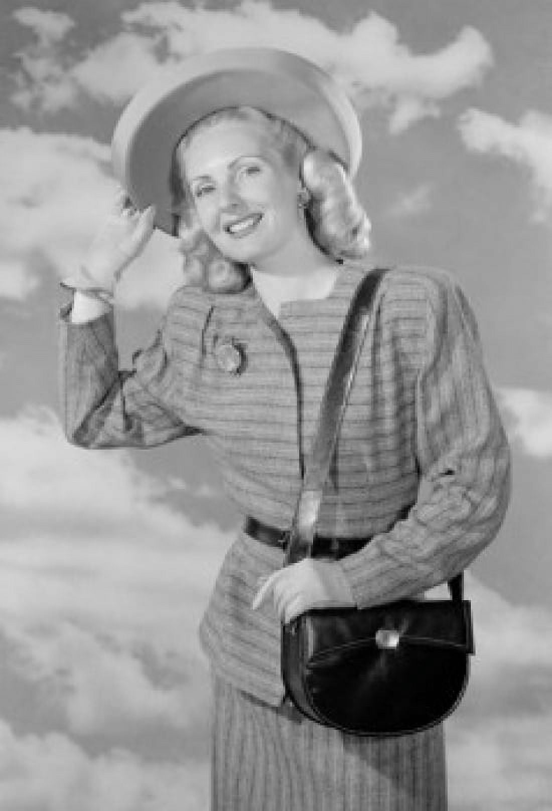 Portrait of young woman wearing hat against clouds Canvas Art - (18 x 24)
